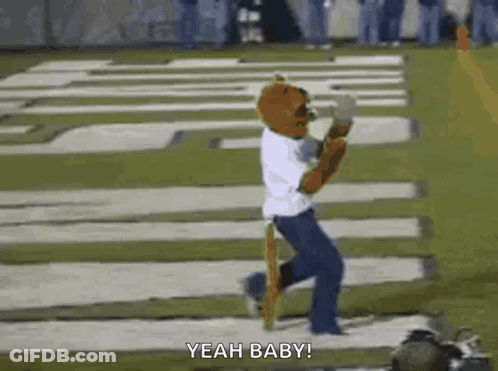 Mascot Running On Football Field In White Shirt And Blue Pants GIF