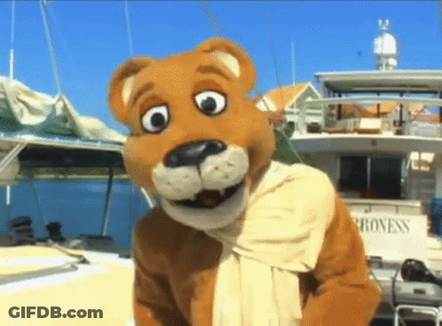 Mascot Standing In Front Of Boat Saying Progress GIF