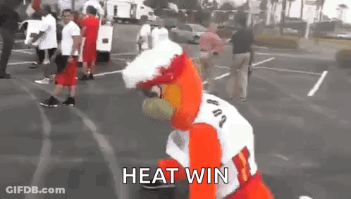 Mascot Standing In Parking Lot Saying Heat Win GIF