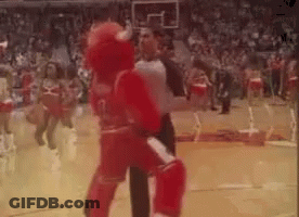 Mascot Standing On Basketball Court With Referee GIF