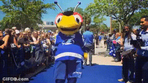 Mascot Standing On Blue Carpet GIF