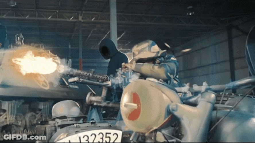 Mask Man Firing The Machine Gun GIF