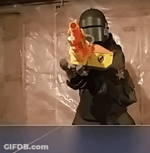 Mask Man Preparing The Machine Gun GIF