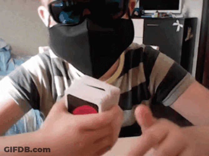 Masked Kid With Blue Uno Reverse Card GIF