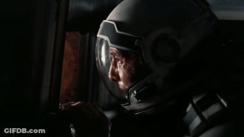 Masked Man In Dark Room GIF