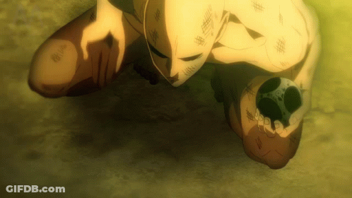 Masked Man Kneeling Holding Something GIF