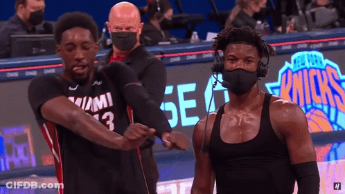 Masked Man Next To Man With Number 13 Tank Top GIF