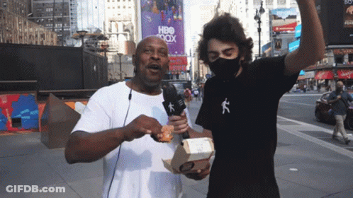 Masked Man With Food Box At HBO Max Sign GIF