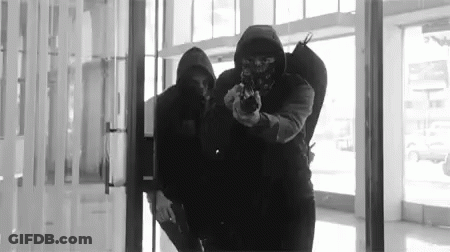 Masked Men Holding Guns GIF