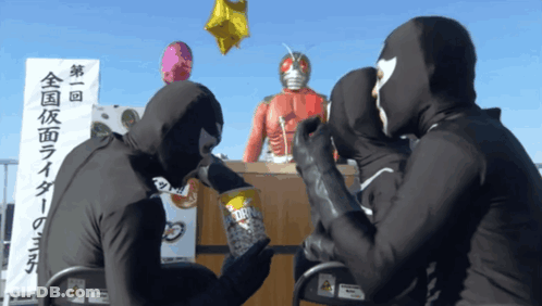 Masked People Gathered In Front Of 第 1 回 Sign GIF