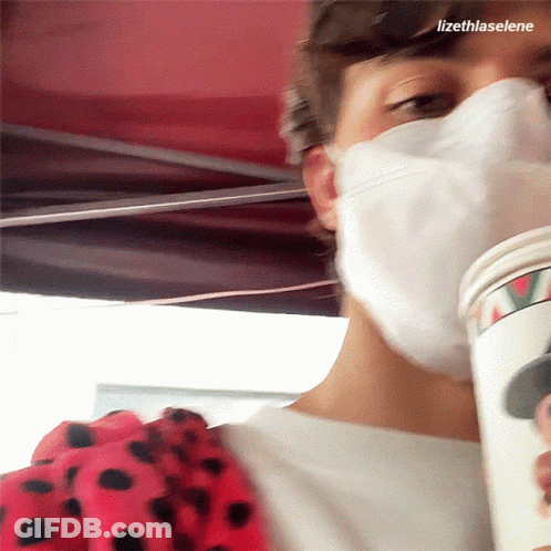 Masked Person Holding Coffee Cup With Name Lizethlaselene GIF