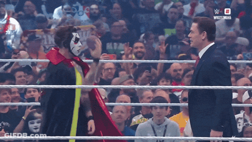 Masked Suited Men Talk In Wrestling Ring W GIF