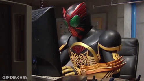 Masked Superhero Sitting At Computer GIF