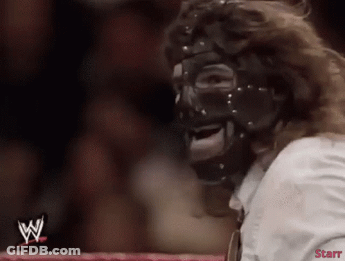 Masked Wrestler Sitting In Ring With Starr Logo GIF
