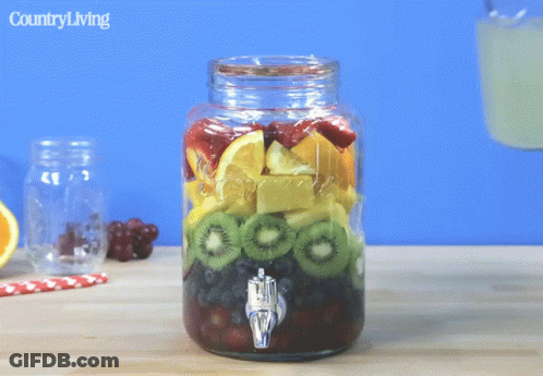 Mason Jar Fruit Pouring Into Glass Country Living GIF