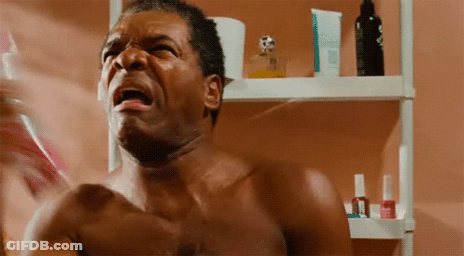 Matured Man Spraying Perfume In The Bathroom GIF