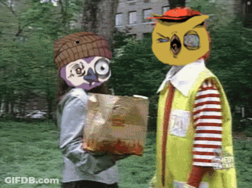 McDonald's Character Giving Bag Of Chips To Girl GIF