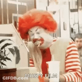 McDonald's Clown Eating Hamburger And Drinking Soda GIF