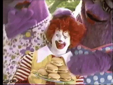McDonald's Clown Holding Plate Of Hamburgers In Front Of Purple Monster GIF