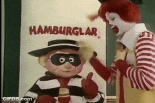 Mcdonald 'S Mascots Are Standing In Front Of A Sign That Says " Hamburglar " GIF