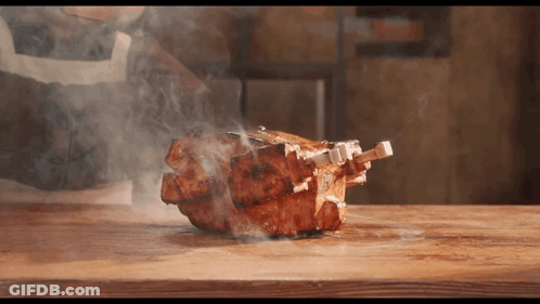 Meat Smoking On Wooden Cutting Board GIF