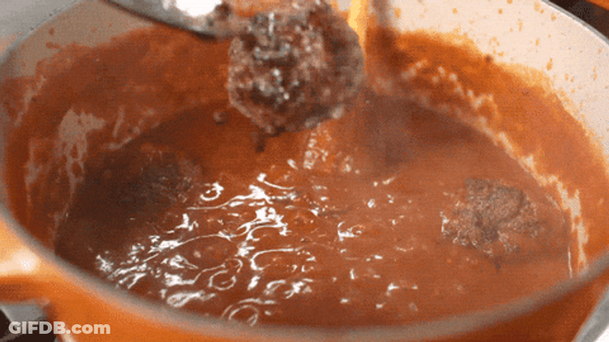 Meatball Being Thrown Into Saucepan GIF