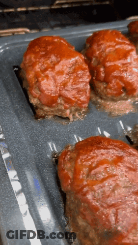 Meatballs Covered In Tomato Sauce Ready To Bake GIF