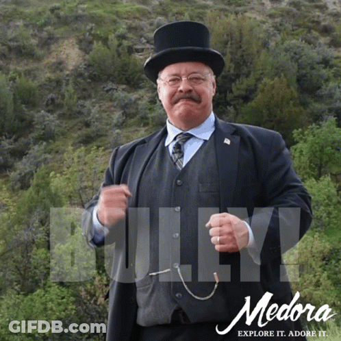 Medora Explore It Ad With Man In Suit And Top Hat GIF