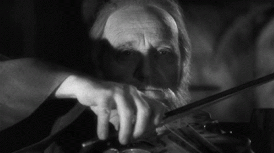 Melancholic Man Worlds Smallest Violin GIF
