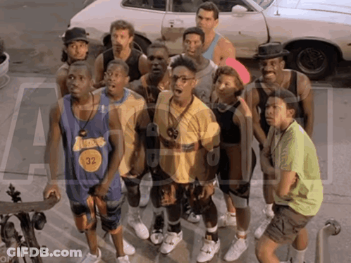 Men By Car With Number 32 On Shirt GIF