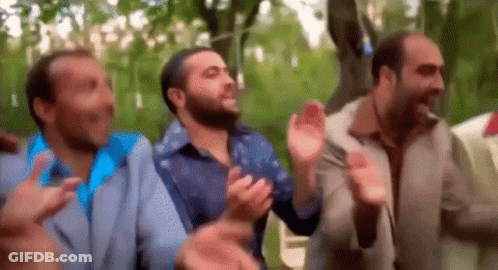 Men Clapping In A Park GIF