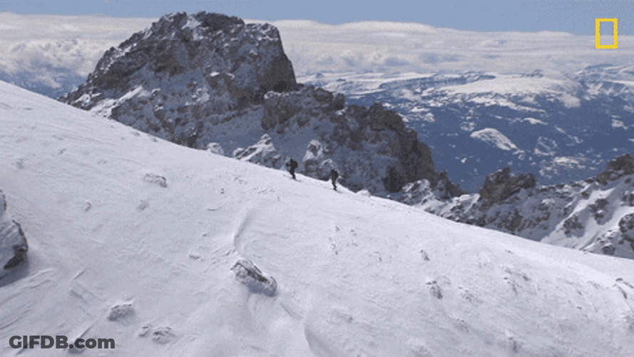 Men Climbing Snowy Mountain GIF