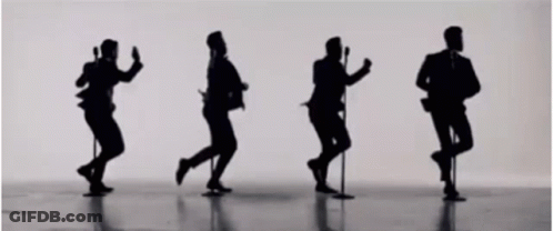 Men Dancing And Singing Into Microphones GIF