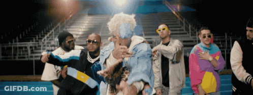 Men Dancing At Bleachers In Colorful Jackets GIF