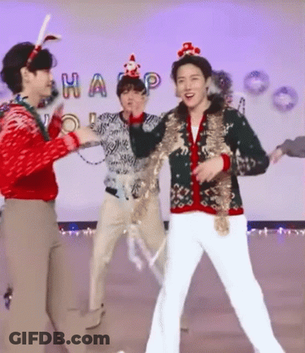 Men Dancing In Christmas Sweaters On Stage GIF