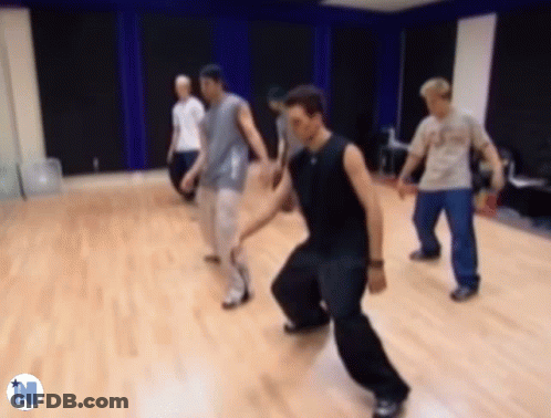 Men Dancing In Dance Studio With Letter N GIF