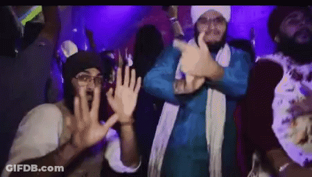 Men Dancing In Dark Room With Purple Lights GIF