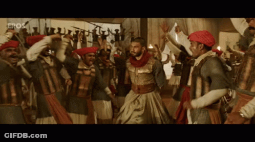 Men Dancing In Front Of Eros Screen GIF