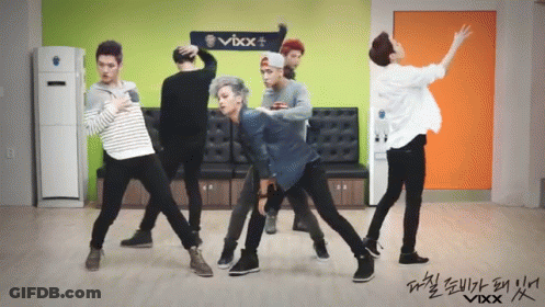 Men Dancing In Front Of VBX Sign GIF
