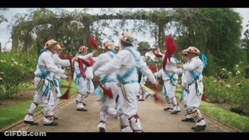 Men Dancing In Garden Path GIF