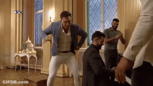 Men Dancing In Room With Stained Glass Window GIF