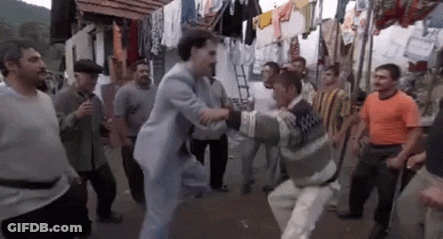 Men Dancing In Street GIF