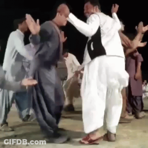 Men Dancing On Dirt Road GIF
