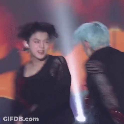 Men Dancing On Stage In Dark Room GIF