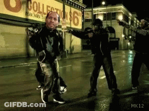 Men Dancing On Street At Collection Store GIF