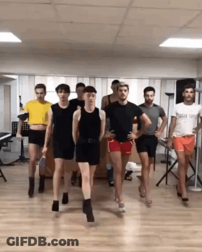 Men Dancing One Wearing Captain Shirt GIF