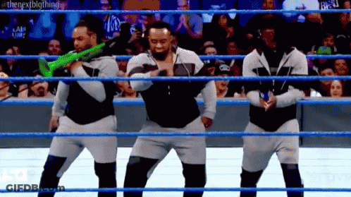 Men Dancing With Guns In Wrestling Ring GIF