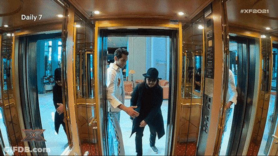 Men Getting Inside Elevator All Together GIF