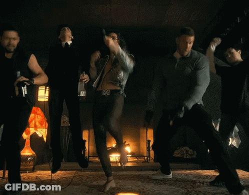 Men Holding Candles And Microphone In Dark Room GIF