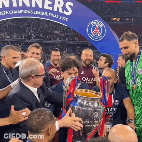 Men Holding Trophy In Front Of Paris Sign GIF
